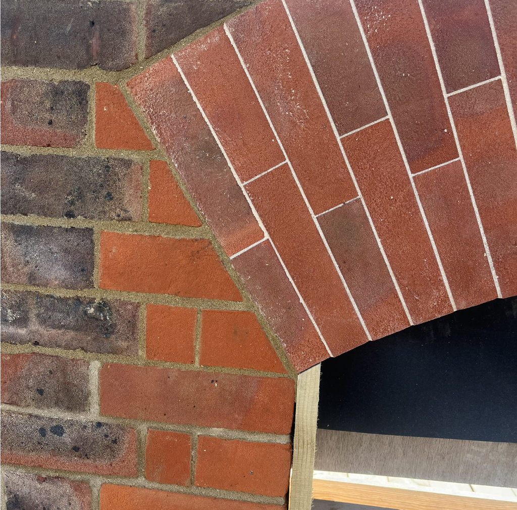 Arch cut into flemish bond brick work