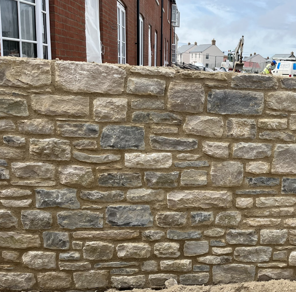 Random dressed purbeck stone wall